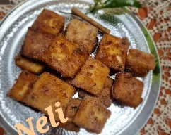 Step <p>Dejar escurrir en papel absorbente y rebozar con canela y azúcar.</p> illustration